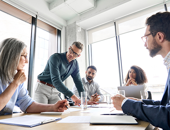 professional business people working together on research plan in boardroom.